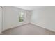 Carpeted bedroom with bright natural light, built-in shelves and ample space at 12501 Garden Tree Ln, Raleigh, NC 27614