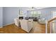 Cozy living room with fireplace, hardwood floors, and comfortable seating at 12501 Garden Tree Ln, Raleigh, NC 27614