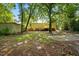 Back view of house and yard with deck and storage shed at 1392 L Cooper Rd, Cameron, NC 28326