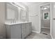 Bathroom boasts a double vanity, updated fixtures, and wood-look flooring at 1392 L Cooper Rd, Cameron, NC 28326