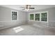 This bedroom includes carpet and windows at 1392 L Cooper Rd, Cameron, NC 28326