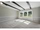 Inviting living room filled with sunlight, plush carpeting, and view of the outdoors through large windows at 1392 L Cooper Rd, Cameron, NC 28326