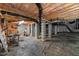 Unfinished basement features exposed piping, concrete columns, and ample open space at 1404 Kings Lassiter Way, Raleigh, NC 27614