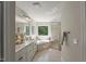Bathroom with double vanity, soaking tub, and tiled shower for a spa-like experience at 1404 Kings Lassiter Way, Raleigh, NC 27614