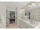 Elegant bathroom with double vanity, spacious layout, and a view to the adjacent bedroom at 1404 Kings Lassiter Way, Raleigh, NC 27614