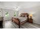 Comfortable bedroom with warm tones, carpet flooring, and natural light from bright windows at 1404 Kings Lassiter Way, Raleigh, NC 27614
