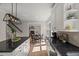 Open kitchen boasts granite countertops, stainless appliances, and island seating near the dining area at 1404 Kings Lassiter Way, Raleigh, NC 27614
