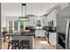 Bright kitchen with granite countertops, white cabinets, and a view of the backyard at 1404 Kings Lassiter Way, Raleigh, NC 27614