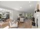 Open-concept living room and dining area with hardwood floors and neutral decor at 1404 Kings Lassiter Way, Raleigh, NC 27614