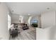 Inviting living room features a comfortable sectional, contemporary decor, and bright natural light at 1404 Kings Lassiter Way, Raleigh, NC 27614