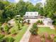 Gorgeous aerial view of the estate showcasing verdant foliage and meticulous landscaping at 1408 Old Ivey Rd, Apex, NC 27523