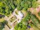 Panoramic aerial shot highlights the house surrounded by a dense green canopy and manicured front lawns at 1408 Old Ivey Rd, Apex, NC 27523