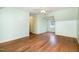 Attic featuring hardwood floors, light green paint, and a window at 1408 Old Ivey Rd, Apex, NC 27523