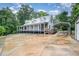 Quaint home with a metal roof, covered porch, and covered parking, blending comfort and rural charm at 1408 Old Ivey Rd, Apex, NC 27523