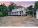 Charming home with a metal roof, covered porch, and covered parking area, ideal for a rural lifestyle at 1408 Old Ivey Rd, Apex, NC 27523
