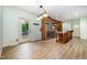 Spacious kitchen features wood cabinets, stainless steel appliances, island and wood flooring at 1408 Old Ivey Rd, Apex, NC 27523