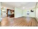 Open living area with hardwood floors, a ceiling fan, and a seamless transition to the kitchen at 1408 Old Ivey Rd, Apex, NC 27523