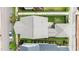 Aerial shot of the property showcasing the roof, landscaping, patio, and fenced backyard at 1423 Tannin Dr, Durham, NC 27713