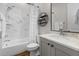 Clean bathroom showcasing a shower and bathtub with white tile and modern fixtures at 1423 Tannin Dr, Durham, NC 27713