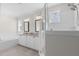 This bathroom features a double vanity, soaking tub, and walk-in shower for spa-like comfort at 1423 Tannin Dr, Durham, NC 27713