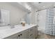 Contemporary bathroom with a double sink vanity, tiled floors, and a shower-tub combination at 1423 Tannin Dr, Durham, NC 27713
