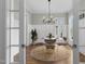 Bright breakfast nook with round table and white wainscoting at 1423 Tannin Dr, Durham, NC 27713