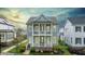 Charming two-story home featuring double balconies, a beautifully landscaped yard, and classic architectural details at 1423 Tannin Dr, Durham, NC 27713