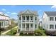 Charming two-story home featuring a double front porch and landscaped front yard at 1423 Tannin Dr, Durham, NC 27713