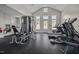 A well-equipped fitness center with modern machines and large windows for a bright and motivating workout space at 1423 Tannin Dr, Durham, NC 27713