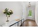Bright foyer showcasing hardwood floors and elegant console table with floral arrangement at 1423 Tannin Dr, Durham, NC 27713