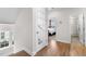 Upstairs hallway with hardwood floors leading to bedrooms and bathrooms at 1423 Tannin Dr, Durham, NC 27713