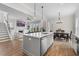 Open kitchen featuring a large island that connects to the living room and dining areas at 1423 Tannin Dr, Durham, NC 27713