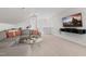 Spacious living room with comfortable seating and a large TV for entertainment at 1423 Tannin Dr, Durham, NC 27713