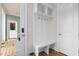 Inviting mudroom with a storage bench, wall hooks, and durable flooring at 1423 Tannin Dr, Durham, NC 27713