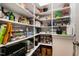 Well-organized pantry with ample shelving and various kitchen appliances at 1423 Tannin Dr, Durham, NC 27713
