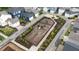 Community playground featuring slides, swings, and a fenced perimeter at 1423 Tannin Dr, Durham, NC 27713