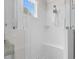 Enjoy this bright, tiled shower with glass enclosure and a rainfall showerhead at 1423 Tannin Dr, Durham, NC 27713
