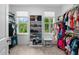Spacious walk-in closet with built-in shelving and natural light from two windows at 1423 Tannin Dr, Durham, NC 27713