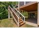 Picture showing view of wooden staircase leading to deck on back of house at 1458 Wragby Ln, Apex, NC 27502