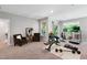 Finished basement area perfect for home gym or recreational area with bench, weights, and treadmill at 1458 Wragby Ln, Apex, NC 27502
