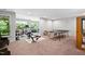 Finished basement area perfect for home gym or recreational area with ping pong table at 1458 Wragby Ln, Apex, NC 27502