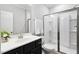 Modern bathroom with a glass-enclosed shower, a stylish vanity, and neutral tones at 1458 Wragby Ln, Apex, NC 27502