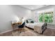 Bedroom featuring a desk, chair, patterned rug, and bright window views at 1458 Wragby Ln, Apex, NC 27502