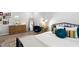 Bedroom with decorative mirror, dresser, desk, and a bright window at 1458 Wragby Ln, Apex, NC 27502