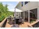 Large deck with dining area and grill overlooking the backyard at 1458 Wragby Ln, Apex, NC 27502