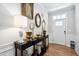 Stylish entryway featuring hardwood floors and decorative mirrors at 1458 Wragby Ln, Apex, NC 27502