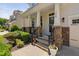 Inviting front porch with stone accents and manicured landscaping at 1458 Wragby Ln, Apex, NC 27502
