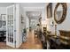 Elegant hallway featuring hardwood floors and decorative accents at 1458 Wragby Ln, Apex, NC 27502