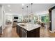 Spacious kitchen island with pendant lighting, stainless steel appliances at 1458 Wragby Ln, Apex, NC 27502