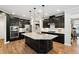 Well-equipped kitchen features stainless steel appliances, custom cabinets and a granite island at 1458 Wragby Ln, Apex, NC 27502